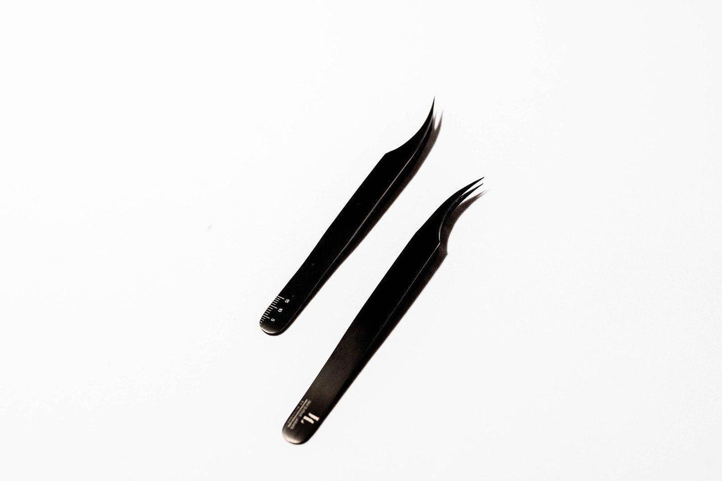 Eyelash Extension Isolation Tweezers with Ruler, featuring precision tips and measurement markings, designed for accurate and efficient isolation of individual lashes during extension application.