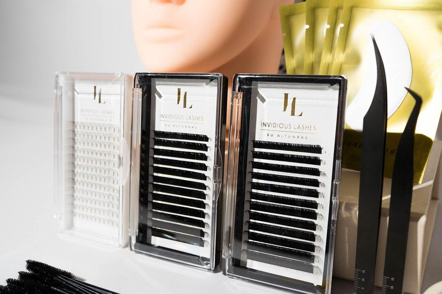 Lash trays, designed for organizing and holding eyelash extensions during application, available in various styles and sizes for efficient and precise lash application.