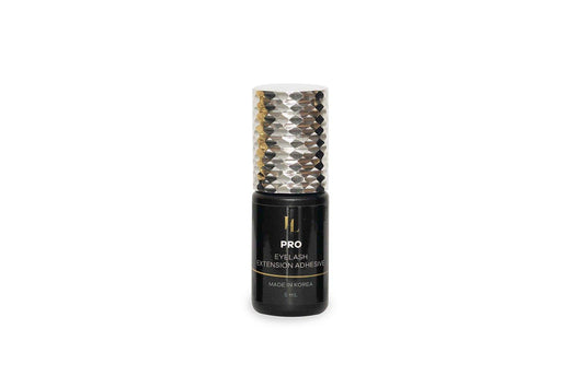 ottle of Eyelash Extension Glue Adhesive - Pro Lash, offering a strong, durable hold and quick drying time, perfect for professional eyelash extension applications.