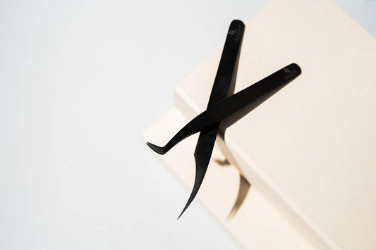 Pair of Eyelash Extension Tweezers, featuring precision tips for accurate lash application, perfect for professional use in creating flawless lash extensions.